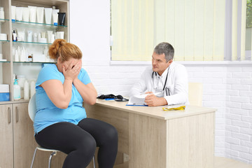 Overweight woman having consultation at doctor's office