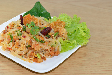 spicy minced pork salad, minced pork mash with spicy, Thai food on the wood background.