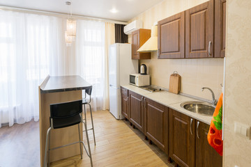 Kitchen interior with a bar counter in the apartment