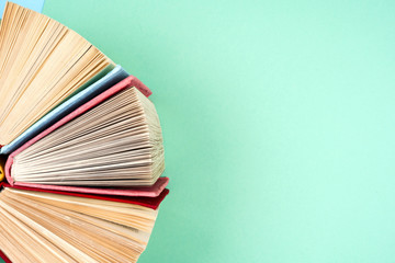 Top view of bright colorful hardback books in a circle.