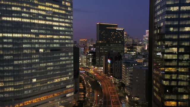 Japan Tokyo Aerial v146 Flying low over Hamarikyu park with Ginza cityscape views dusk 2/17