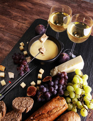 Gourmet Swiss fondue dinner on a winter evening with assorted ch