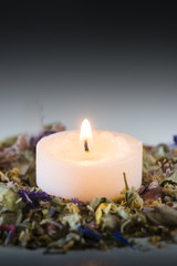 Obraz na płótnie Canvas Flower potpourri with lit candle.