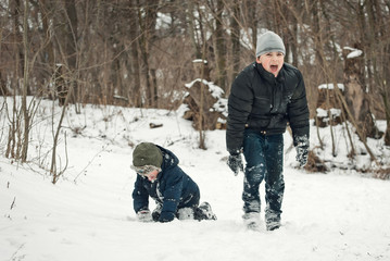 the guys are playing in the snow in the winter