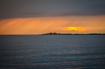 sunbeams during sunset at swedish landscape