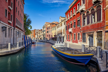 Fototapeta na wymiar View of The Venice Street And Canal with boats in Venice, Italy.