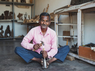 Portrait of a craftsman of wood in his workshop