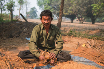 Asian farmer preparing elephant food