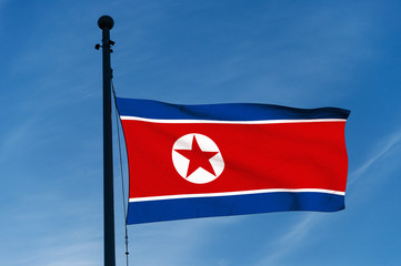 North Korea flag over blue sky background (3D rendered illustration)
