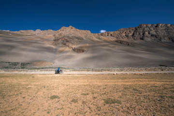 Biker in a desert road