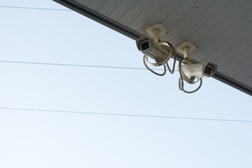 surveillance cameras fixed under a shelter