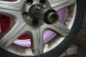 tyre on the balancing machine prepared for balancing at the tyre shop