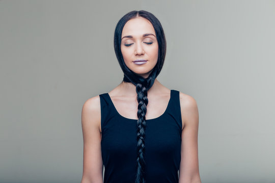 Close-up Portrait Of Female With Long Hair Braided In Beard