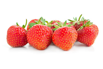 many berries ripe juicy strawberries on a white table