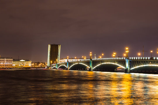 Night view of the Troitsky Bridge (Trinity bridge) with illumination in St.Petersburg, Russia