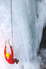 The climber climbs on ice.
