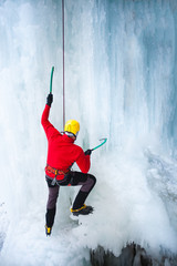 The climber climbs on ice.