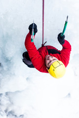 The climber climbs on ice.