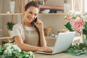 Young woman florist occupation working with flowers