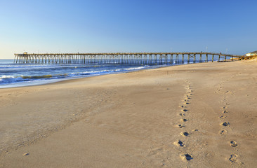 Fishing pier and sand at Kure Beach, North Carolina