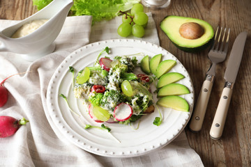 Plate with broccoli salad on table