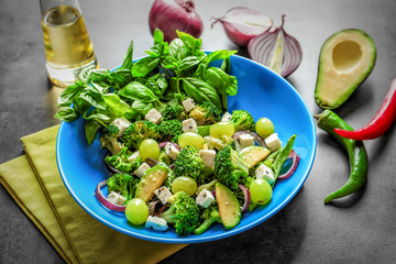 Dish with broccoli salad on table