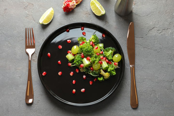 Plate with broccoli salad on table
