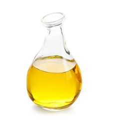 Glass jug with cooking oil on white background