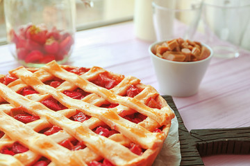 Strawberry rhubarb pie on table, closeup