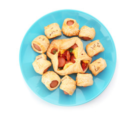 Plate with delicious pastry with sausage on white background