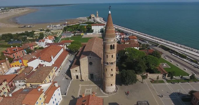 Italy town of Caorle with chapel and colorful houses with a view from the top