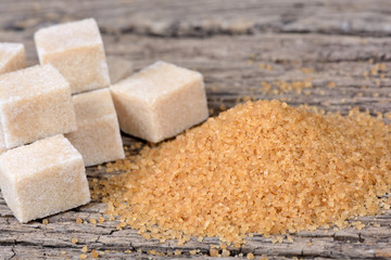 Beige sugar on wooden table