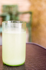 Fresh pineapple water juice in rustic glass