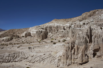 Fototapeta premium Eroded rock formations along Quebrada Chuba, a river valley high on the Altiplano of northern Chile in Lauca National Park.