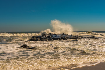 Waves Smash up Against the Rocks