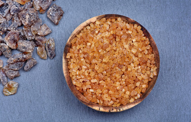 Brown candy crystals on slate