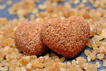 Sugar heart with brown candy crystals on slate