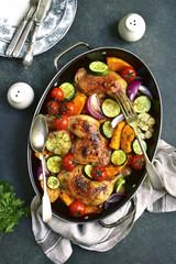 Chicken legs roasted with vegetables.Top view.