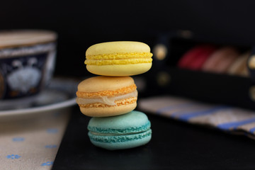 Tasty sweet macarons and cofe. Macaroons on table