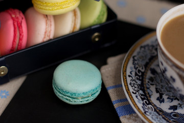 Tasty sweet macarons and cofe. Macaroons on table