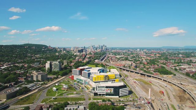 Montreal Quebec Aerial V88 Flying Low Near Freeway Interchange And Hospital Panning Cityscape Views 7/17