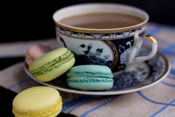 Tasty sweet macarons and cofe. Macaroons on table