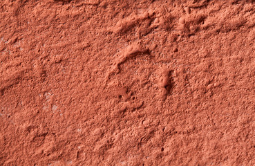 Fragment of a wall made of red fire-brick