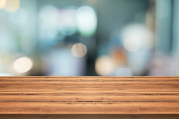 Empty wood table top on blurred background,for montage your products