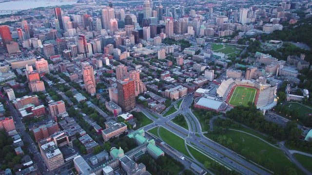 Montreal Quebec Aerial v96 Birdseye view flying over downtown panning up cityscape sunset 7/17