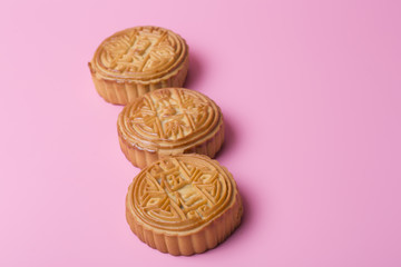 Mooncake on the pink background. Chinese traditional food. Chinese mid autumn festival.