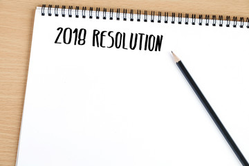 2018 resolution on blank paper notebook background, with copy space for text, business background concept