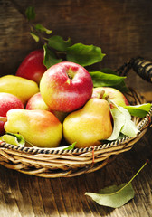 Fresh apples and pears on wooden table. Autumn Harvest