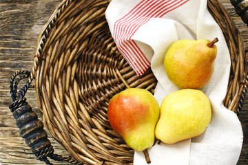 Fresh pears in wicker tray