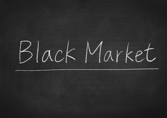 Fototapeta na wymiar black market concept word on a blackboard background